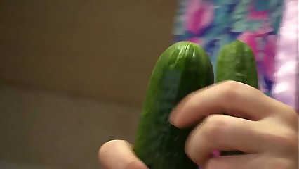 Slim girl with a hairy pussy masturbates with cucumber